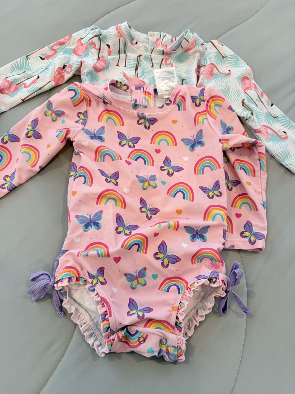 Ruffle Butts Toddler Set of 2 - Rainbow & Flamingo Long-Sleeve Swimsuits 2T